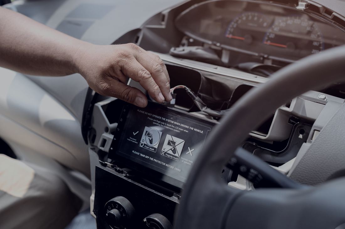 Head unit being fitted into a dashboard